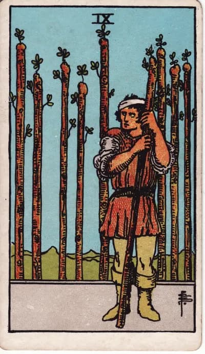 The Nine of Wands tarot card (Rider–Waite–Smith, 1909)