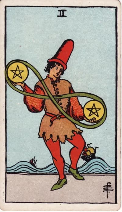 The Two of Pentacles tarot card (Rider–Waite–Smith, 1909)