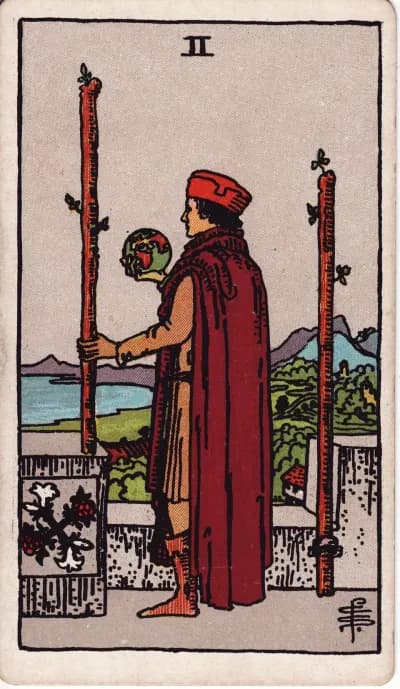 The Two of Wands tarot card (Rider–Waite–Smith, 1909)